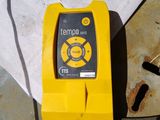 a yellow device that is sitting on top of a table