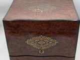 an old wooden box with a decorative design on the lid