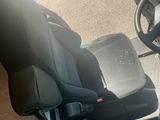 an image of a car seat with a steering wheel
