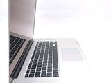 a laptop computer that is open on a white surface