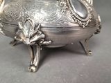 a silver bowl that is sitting on a table