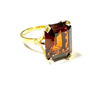 an image of a ring with a large brown stone in it
