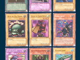 a lot of different pokemon cards that are on display