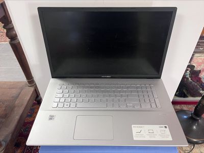 a laptop computer sitting on top of a table
