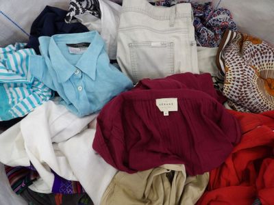 a pile of clothes that is sitting in a bag