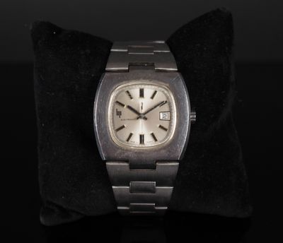 an image of a silver watch on a black cushion
