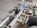 a machine that is working on pipes in a factory