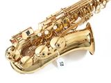saxophone on a white background with a price tag attached to it