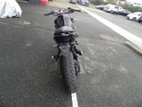 a motorcycle that is parked on the side of the road