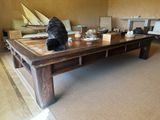 a coffee table with a statue of a bear on it