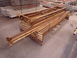 a large pile of steel bars stacked on top of each other