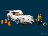 a lego car with a man standing next to it