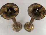 pair of antique brass candlesticks on a white background