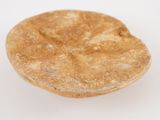a piece of bread that is sitting on a white surface