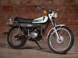 a motorcycle that is parked in front of a brick wall