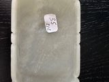 a plastic container with a sticker on it on a table
