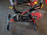 two stationary exercise bikes on display in a gym