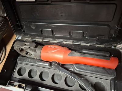 a tool in a tool box with a wrench