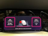 a picture of a car ' s dashboard with a display on it
