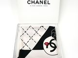 chanel scarf in a box with a lipstick print on it