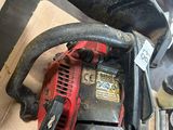 a chainsaw that is sitting on top of a box