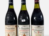 trois bouteilles de vin posées l'une à côté de l'autre sur une table