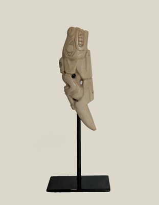 an image of a statue of a man with a knife on a stand