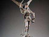 an image of a statue of an angel holding a sword