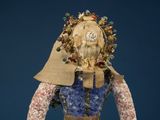 a close up of a sculpture of a person with a hat on