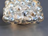 a close up of a glass object on a table