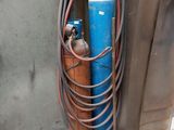a blue fire hydrant next to a metal door