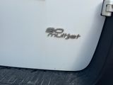 a close up of the emblem on the door of a white truck