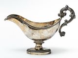 silver plated gravy dish on stand with ornate decoration
