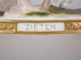 an image of a porcelain figurine of a man and a woman in a landscape