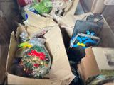 a cardboard box full of assorted items in the back of a truck