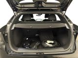 a trunk of a car with a bunch of electronics in it