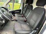 the interior of a van with black seats and a steering wheel