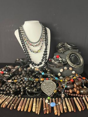 some of the necklaces and bracelets are on display on a table