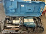 a blue tool case with tools in it on the floor