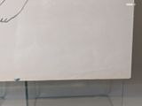 a white board with a drawing on it in a glass case