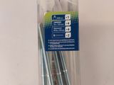 four screws in a package on a white table