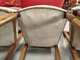 two chairs that are sitting next to each other in a room