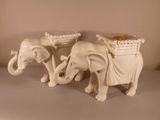 two elephants that are standing next to each other