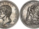 a close up of a coin with a woman and a man on it