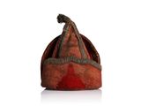 a red hat that is sitting on top of a white table