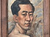 portrait of a man in a wood frame with wheat in the background