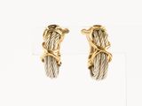 a pair of gold and silver earrings with twisted wire