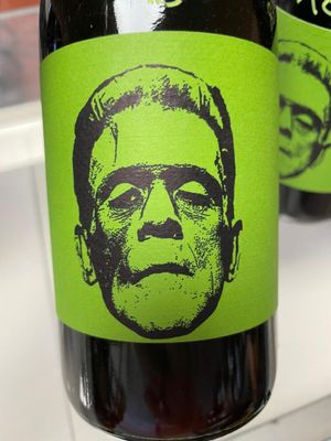 a bottle of beer with a picture of a man on it