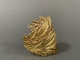 an image of a gold ring with a leaf design on it