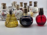 a lot of perfume bottles that are sitting on a table